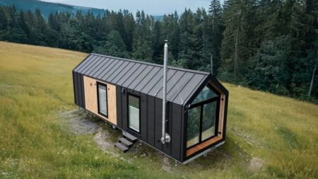 Mobi Kolos Desert Tiny House Packs Built-In Fireplace and Tons of Storage Mobi Kolos Desert Features a Built-In Fireplace Next to Living Room by Large Window