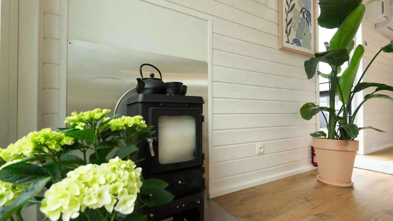 Mobi Kolos Desert Features a Built-In Fireplace Next to Living Room by Large Window - fireplace installation