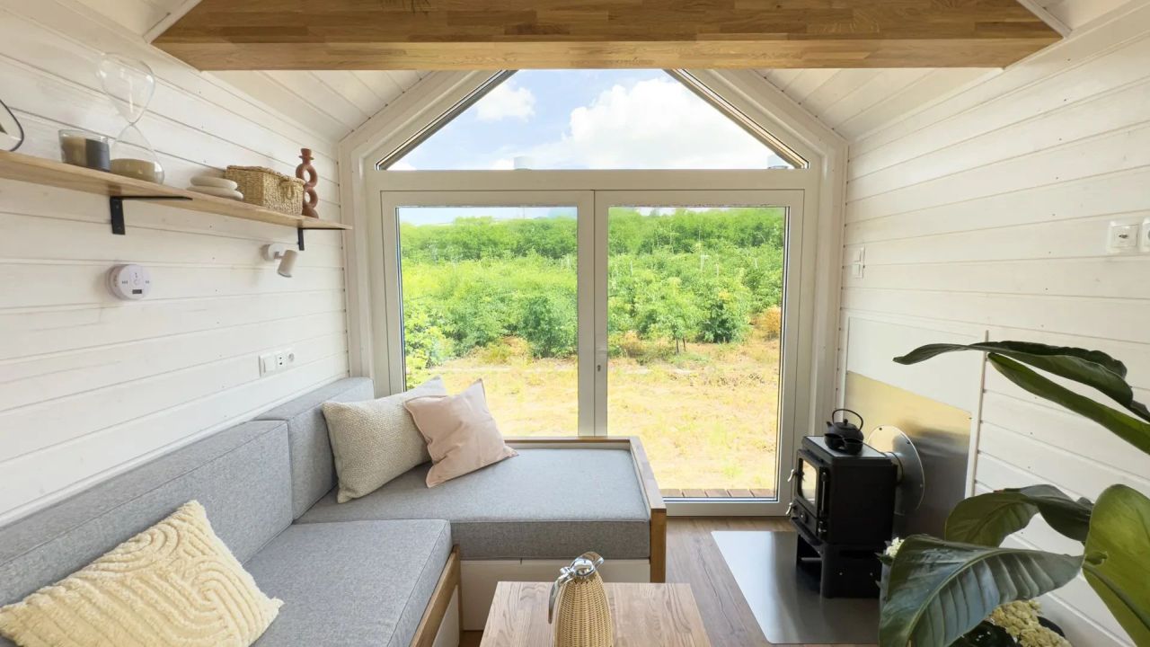 Mobi Kolos Desert Features a Built-In Fireplace Next to Living Room by Large Window- fireplace seating