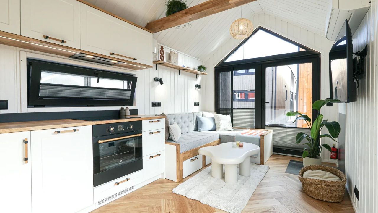 Mobi Kolos Desert Features a Built-In Fireplace Next to Living Room by Large Window - living room with seating