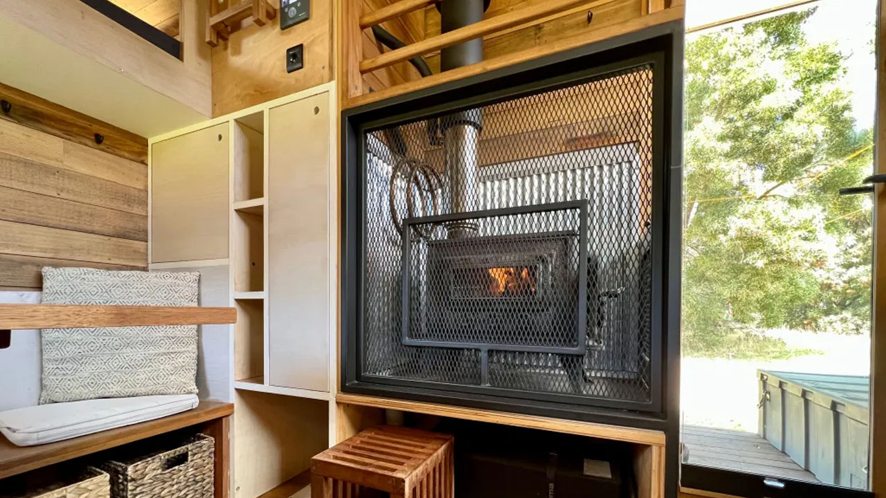 Off-grid sustainable tiny house-enclosed wood stove