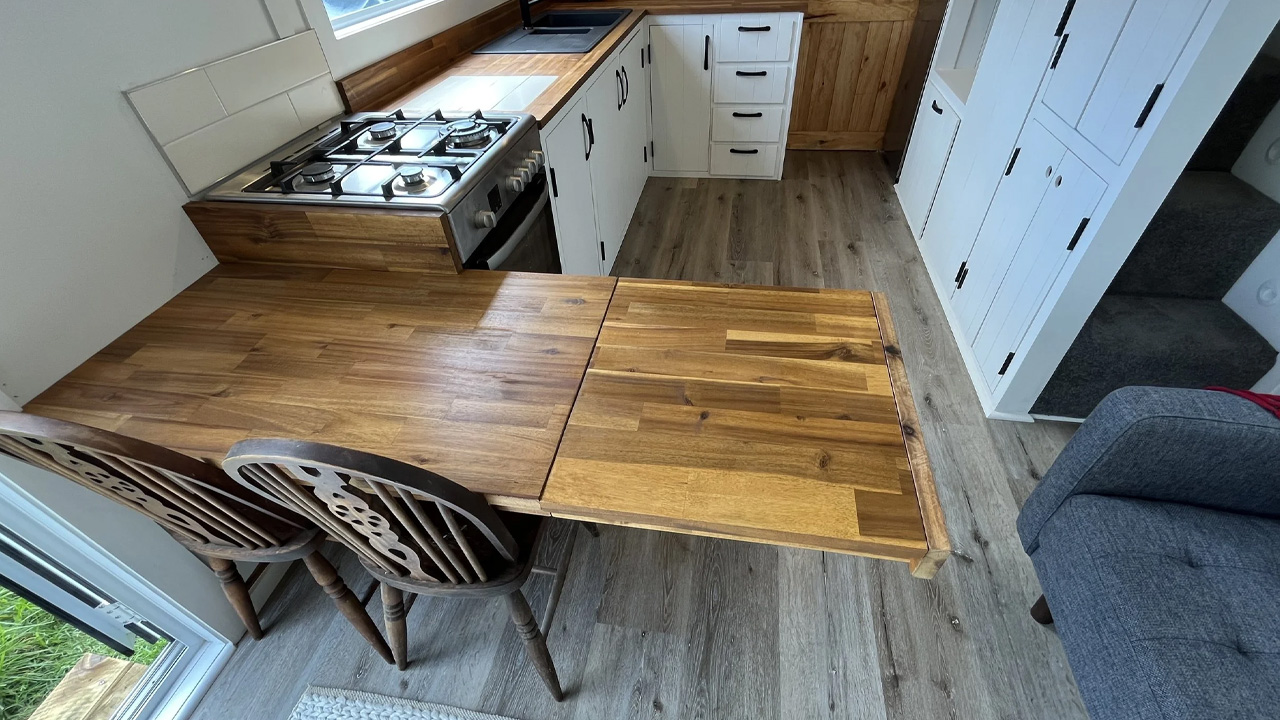 Old Man Pine Tiny House_extendable dining table in the kitchen