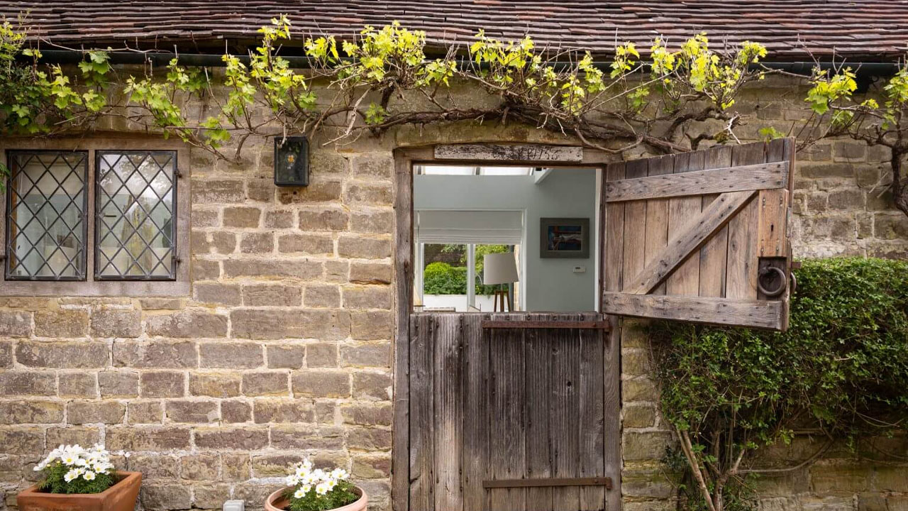 Princess Margaret’s West Sussex Estate-rustic stone-brick facade