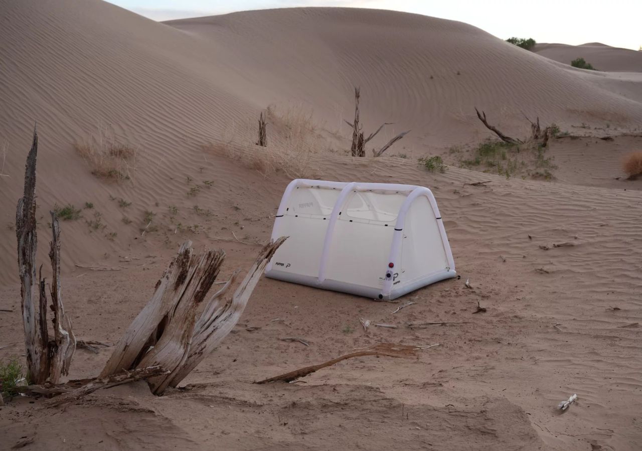 Puffer Tent Features Separate Inflatable Base and Structural Frame - set up in desert in uneven surface