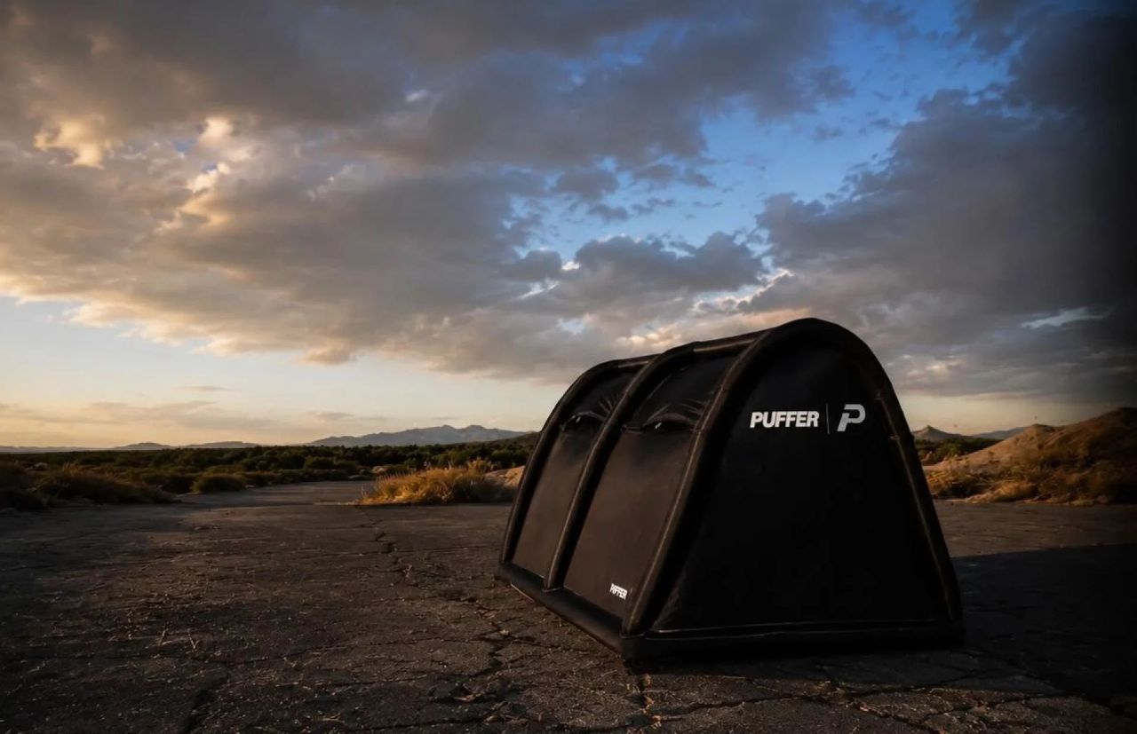 Puffer Tent Features Separate Inflatable Base and Structural Frame in black color