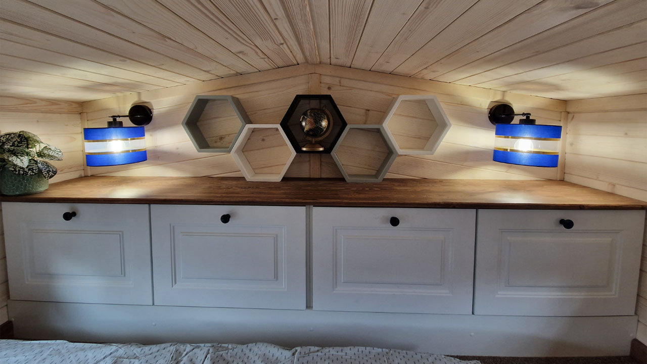 Rosa Tiny House-storage cabinet with hexagon wall decor