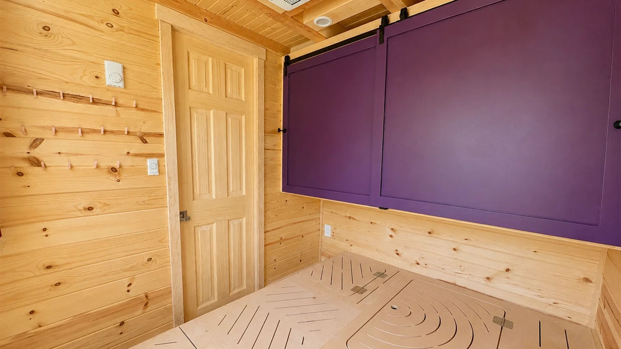 Scandinavian-style tiny house-groundfloor bedroom with sliding closet