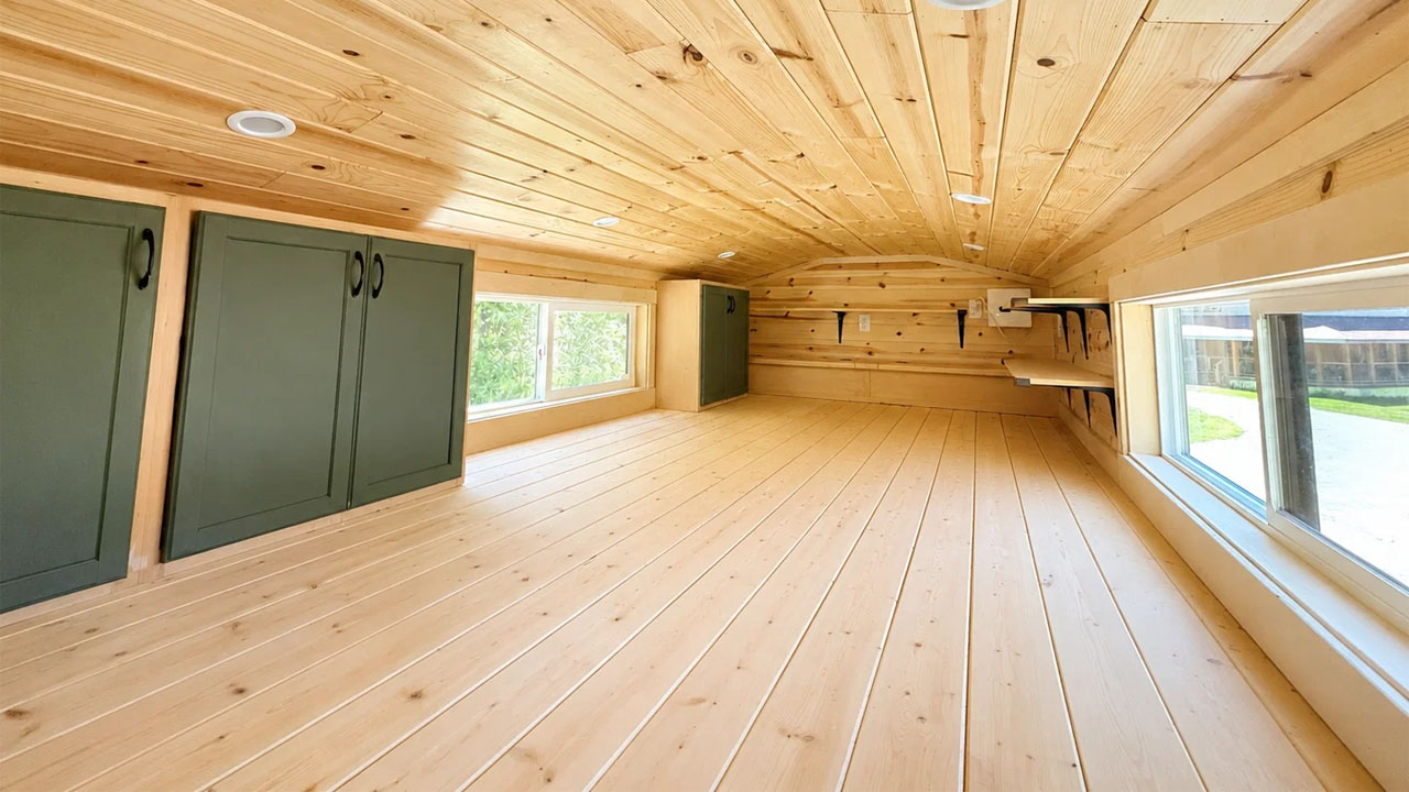 Scandinavian-style tiny house-primary loft bedroom