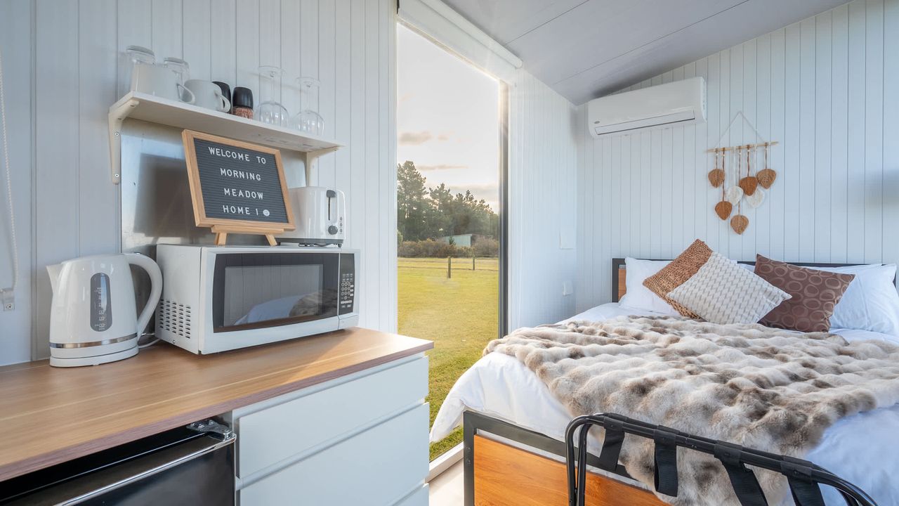 Tiny House with Clever Window Arrangement - opening in bedroom