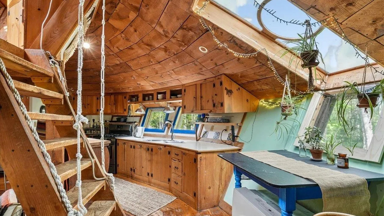 UFO-shaped dreamy rustic cabin-rope-draped stairs