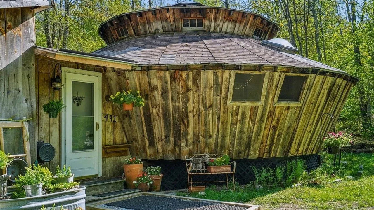 UFO-shaped dreamy rustic cabin-textured wood facade