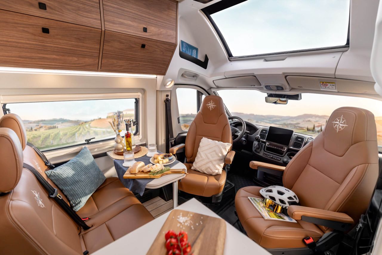 Westfalia Columbus Liner Luxury Camper Van Features Rooftop Terrace Accessed from Bedroom - dining area in front