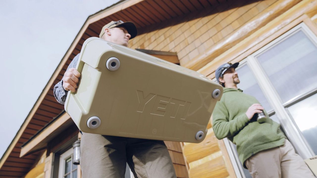 YETI Tank 30 Beverage Tub for Outdoor Parties - carried in hand
